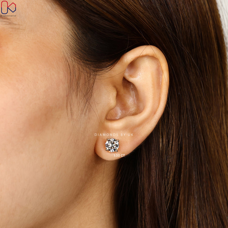 Handmade round diamond studs with four prong setting.  
