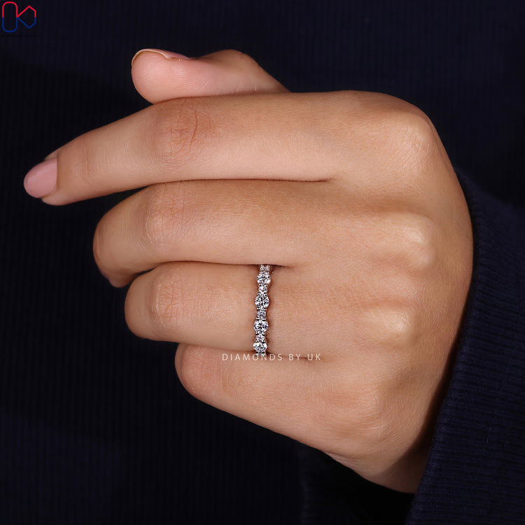 Handmade lab grown diamond wedding band with prongs.