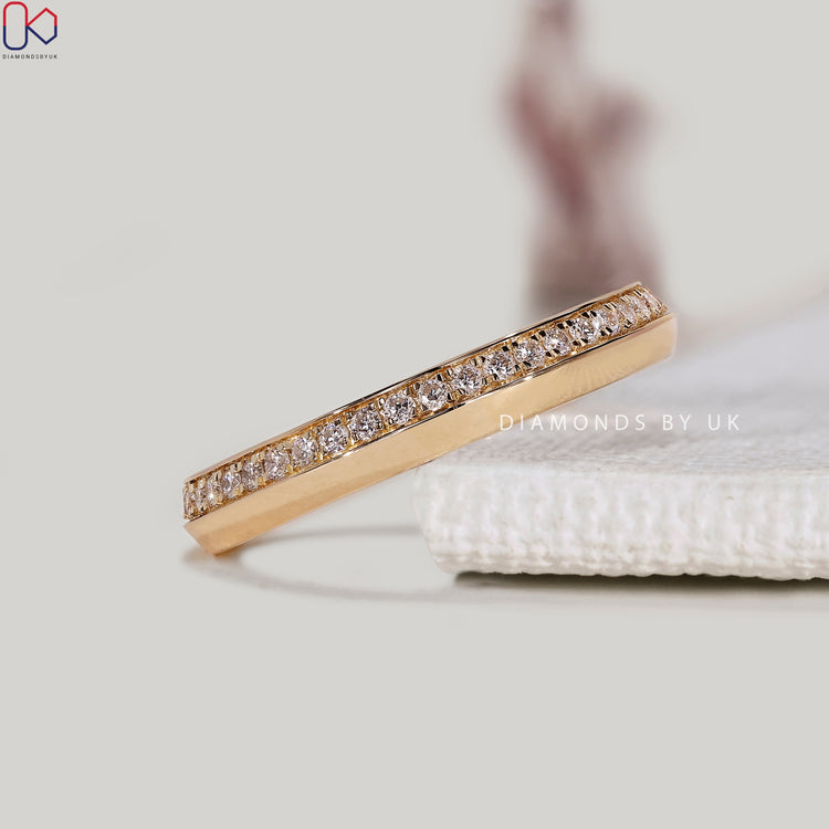 Round lab grown diamond band with one sided pavé style.