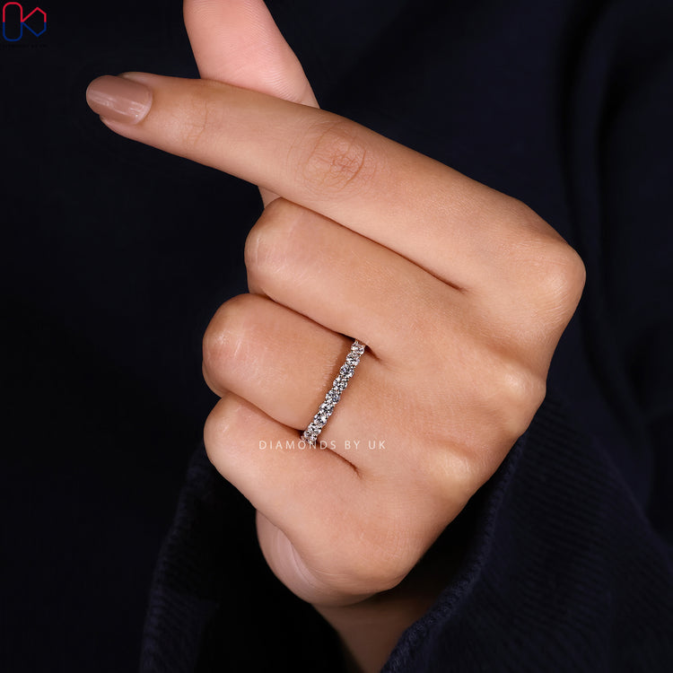 Diamondsbyuk round diamond wedding band with eternity style.
