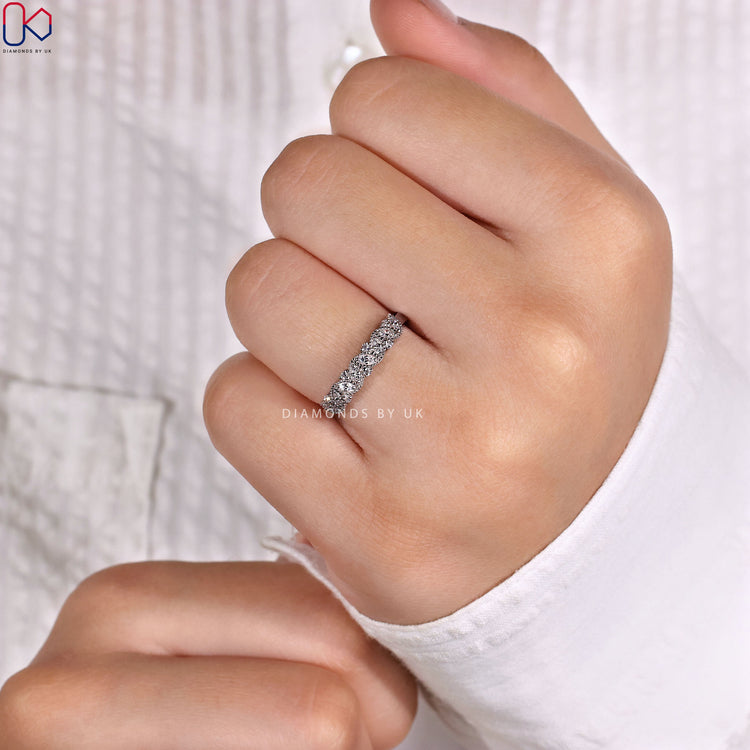 Diamondsbyuk round diamond band with milgrain setting.