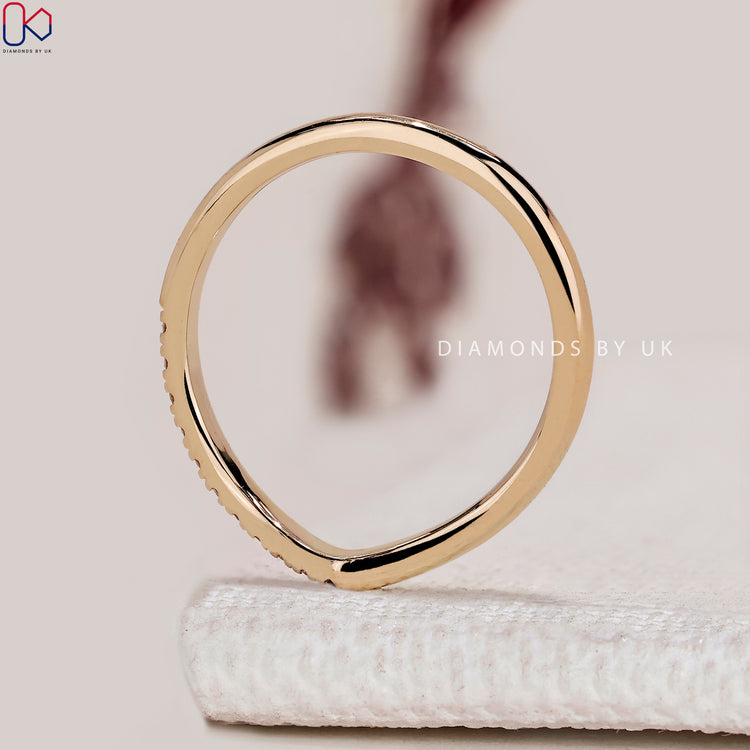 V shaped chevron wedding band with round diamonds.
