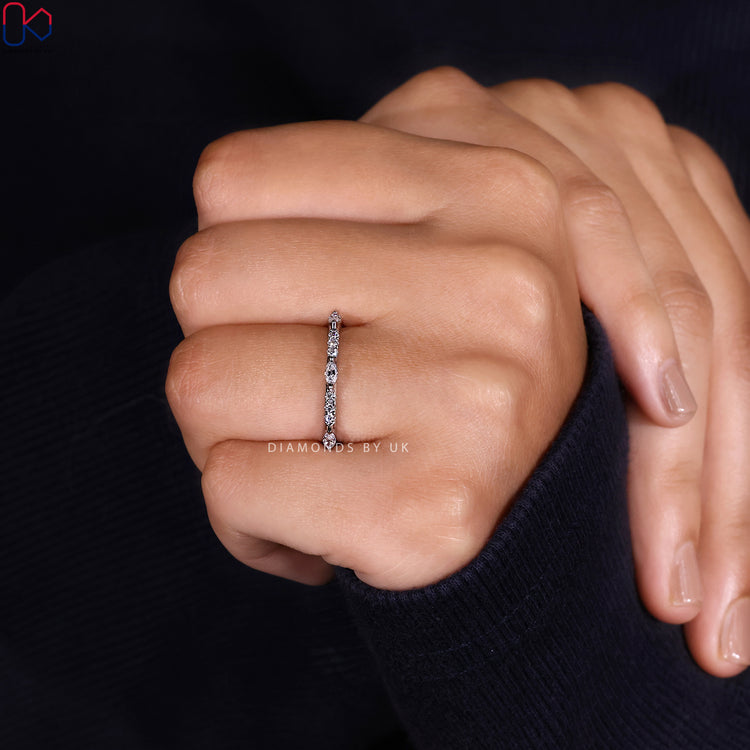 Diamondsbyuk round and marquise diamond half eternity band.
