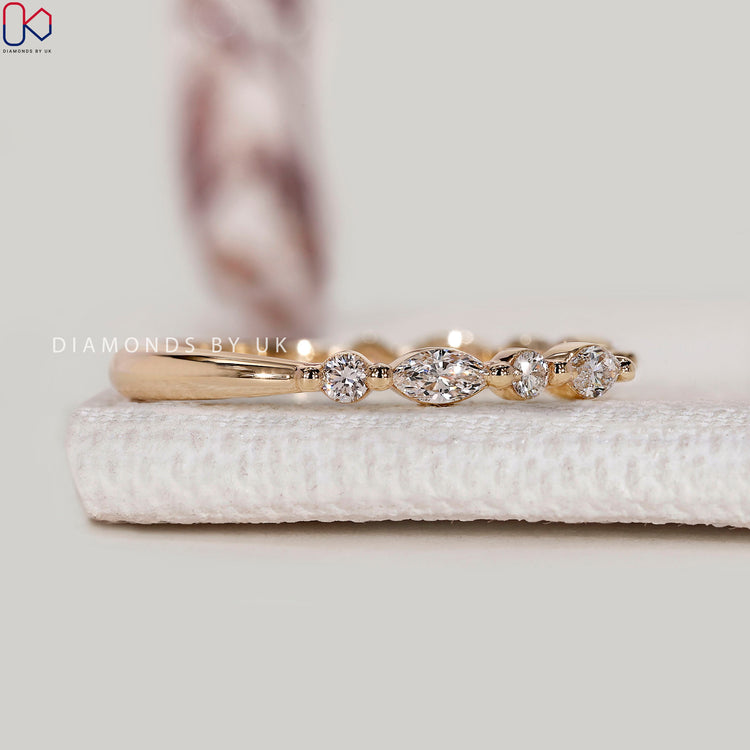 Lab grown diamond Band with round and marquise stones.