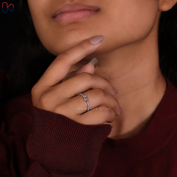 Bypass diamond band with round and marquise stones.