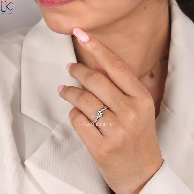 Round cut ring with four compass prong setting.