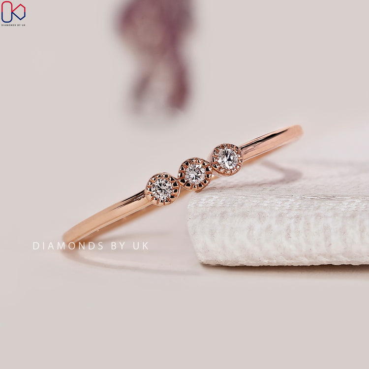 Round diamond band with bezel milgrain setting.

