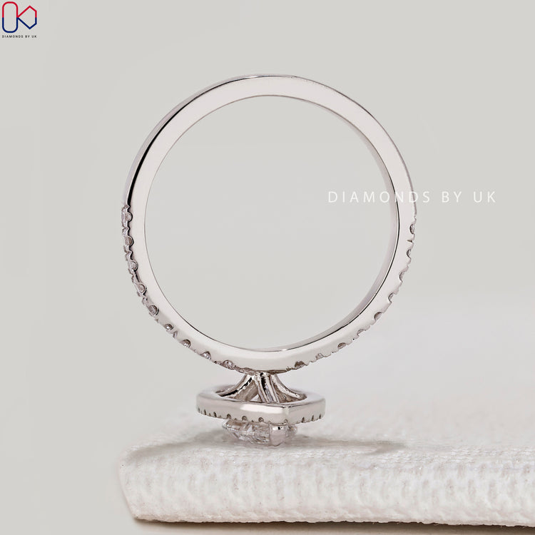 Marquise cut ring with halo and pavé diamonds.
