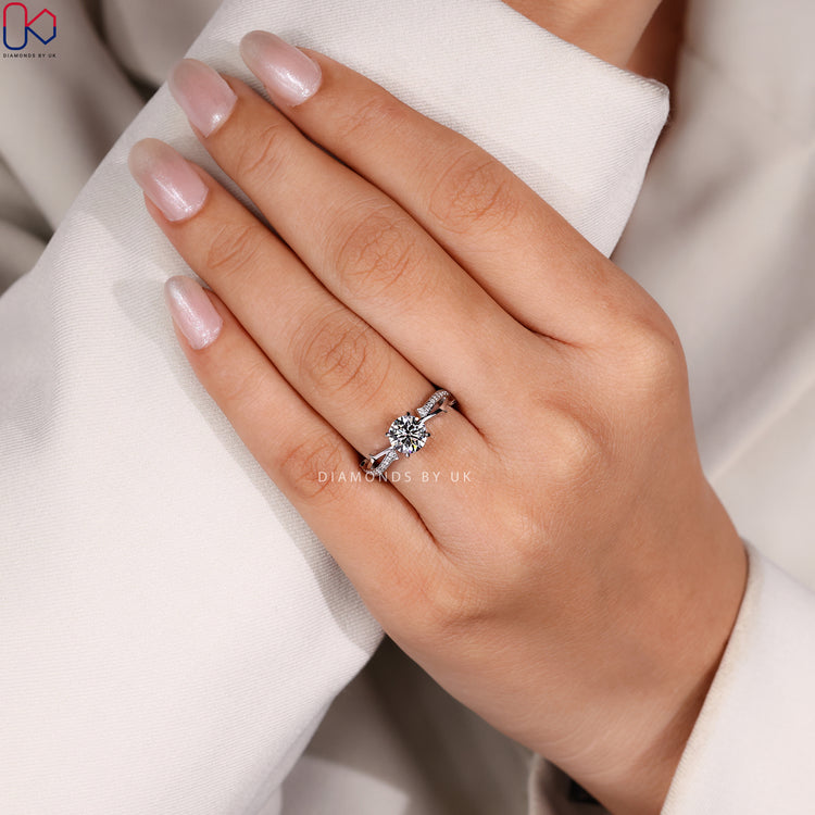 Round cut ring with four claw prong setting.