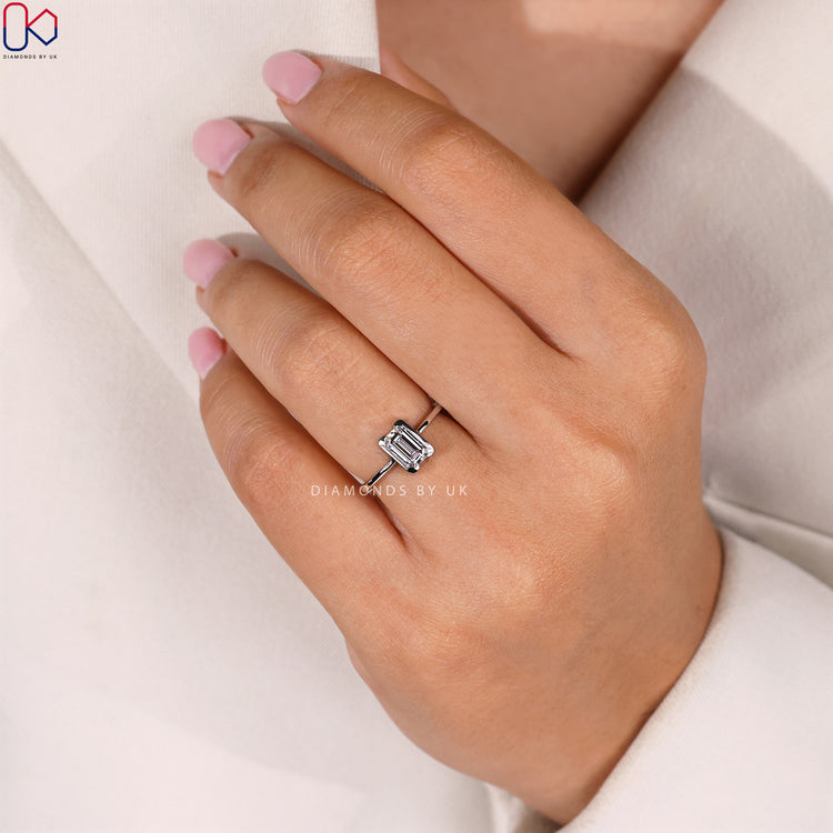Half bezel emerald cut diamond ring, handmade.
