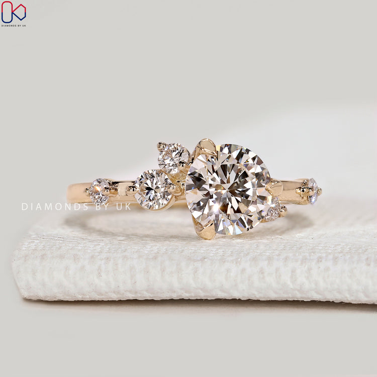 Round cut lab grown diamond ring with cluster style.