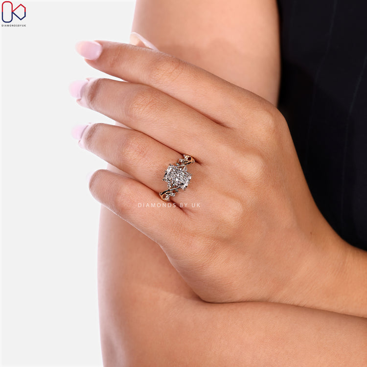Handmade radiant diamond ring with round side stones.
