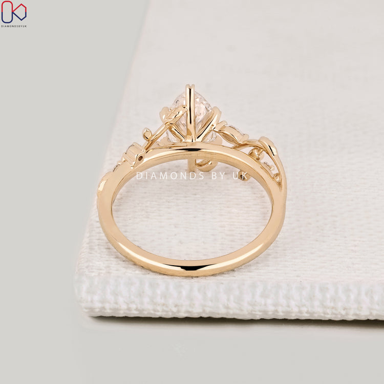 Handmade marquise diamond ring with leaf style prongs.
