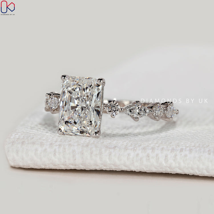 Radiant cut lab grown diamond ring with shared pavé.