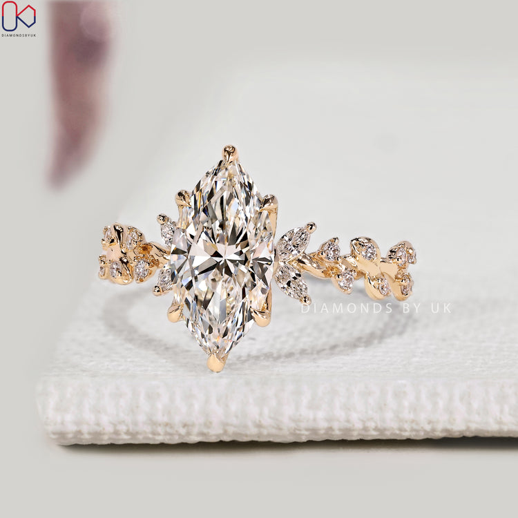 Marquise diamond ring with round and marquise side stones.
