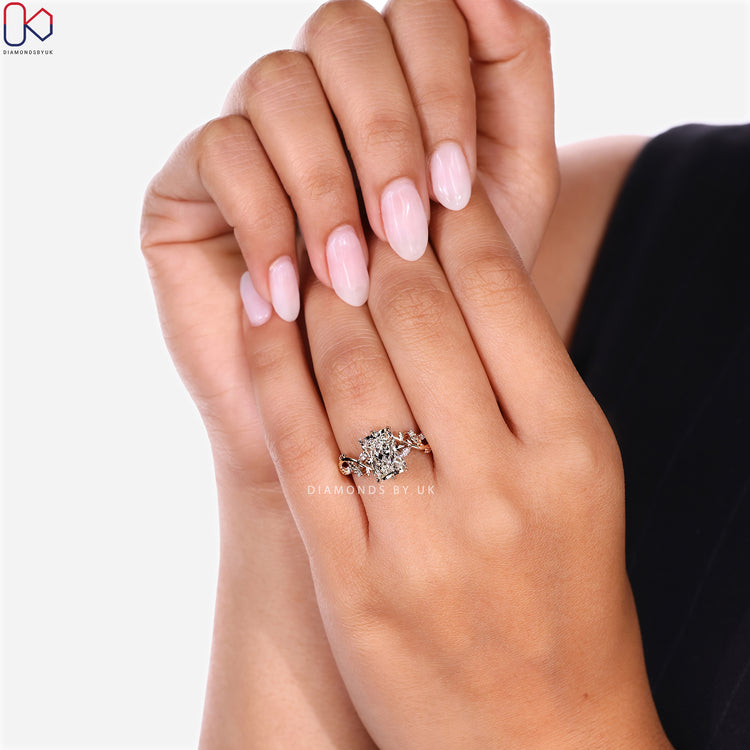 Diamondsbyuk radiant ring with marquise side stones.

