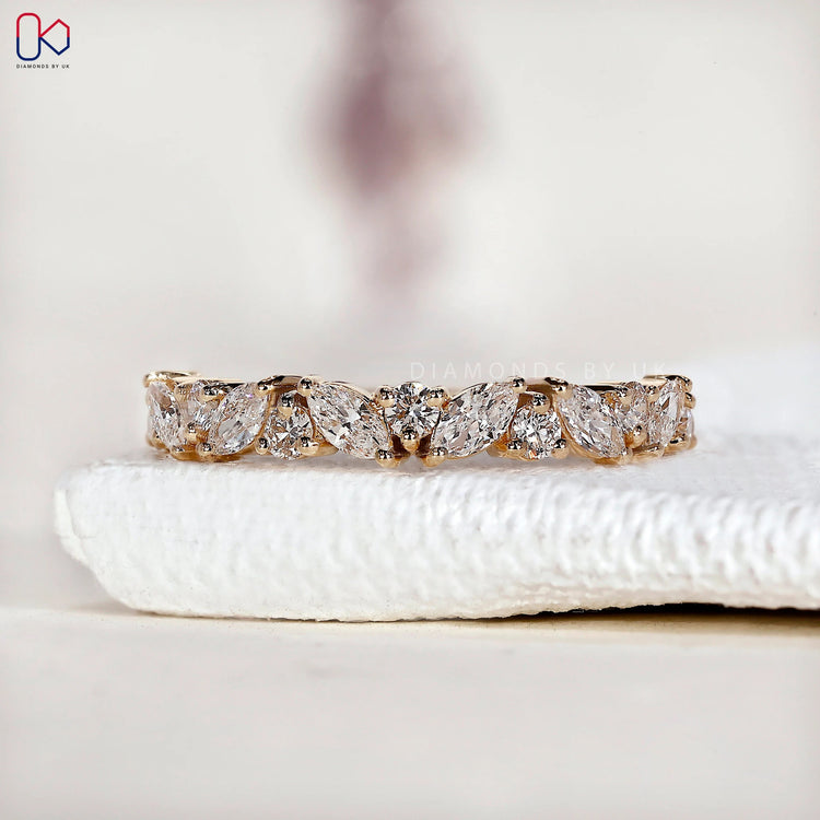 Alternating marquise diamond wedding band designed with prong set lab grown diamonds.
