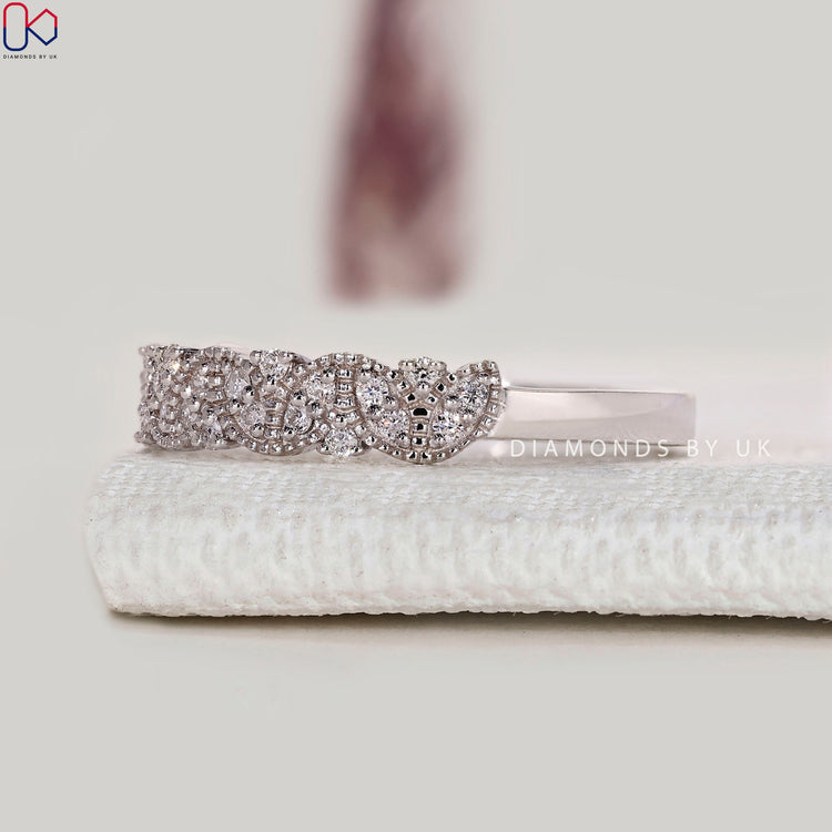 Lab grown round diamond band with milgrain setting.