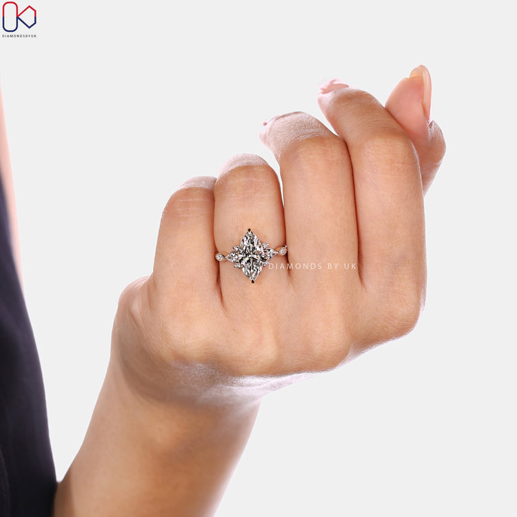 Marquise engagement ring with vintage style and muse setting.
