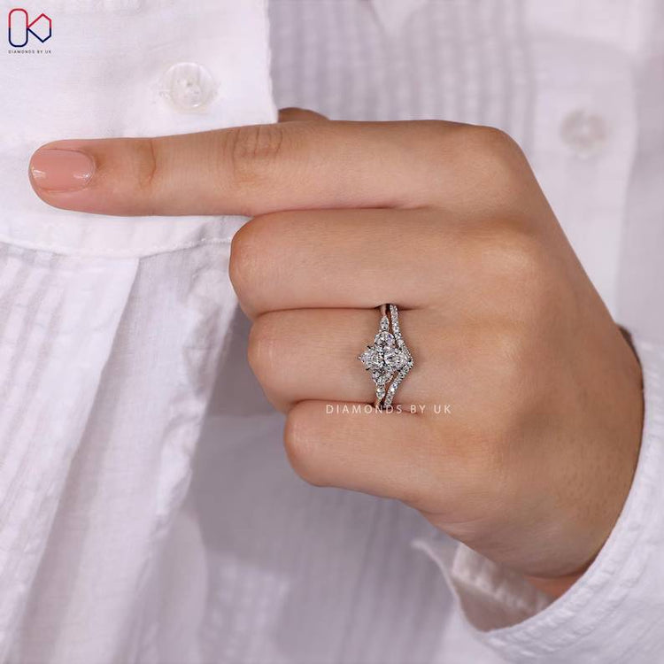 Handmade marquise engagement ring with side stones.