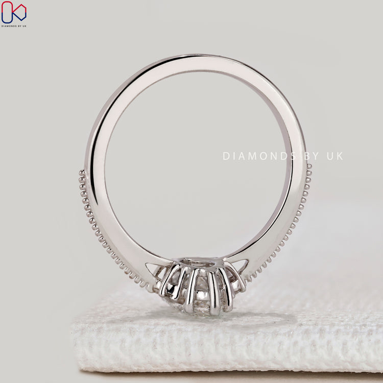 Marquise ring with cathedral and milgrain setting.