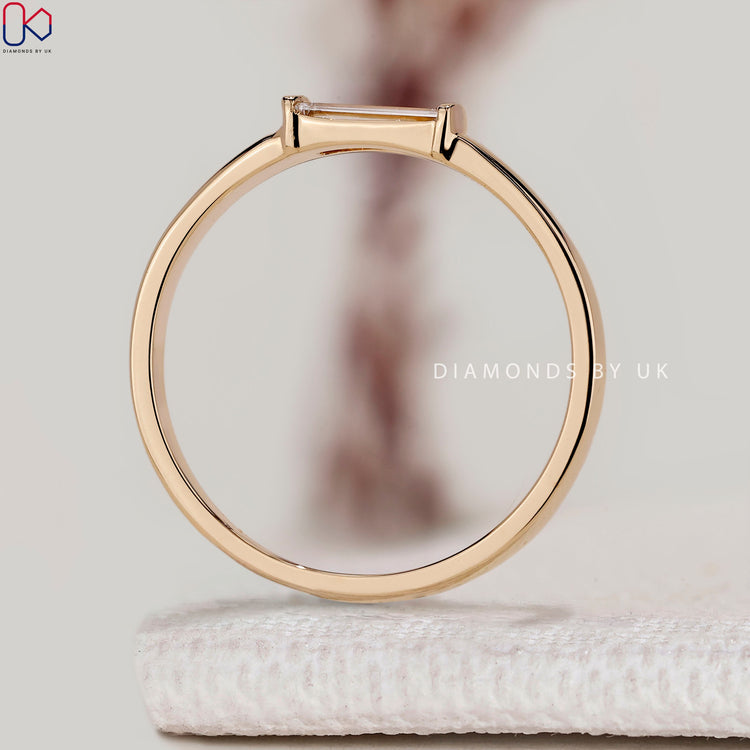 Baguette diamond wedding band with minimalist design.
