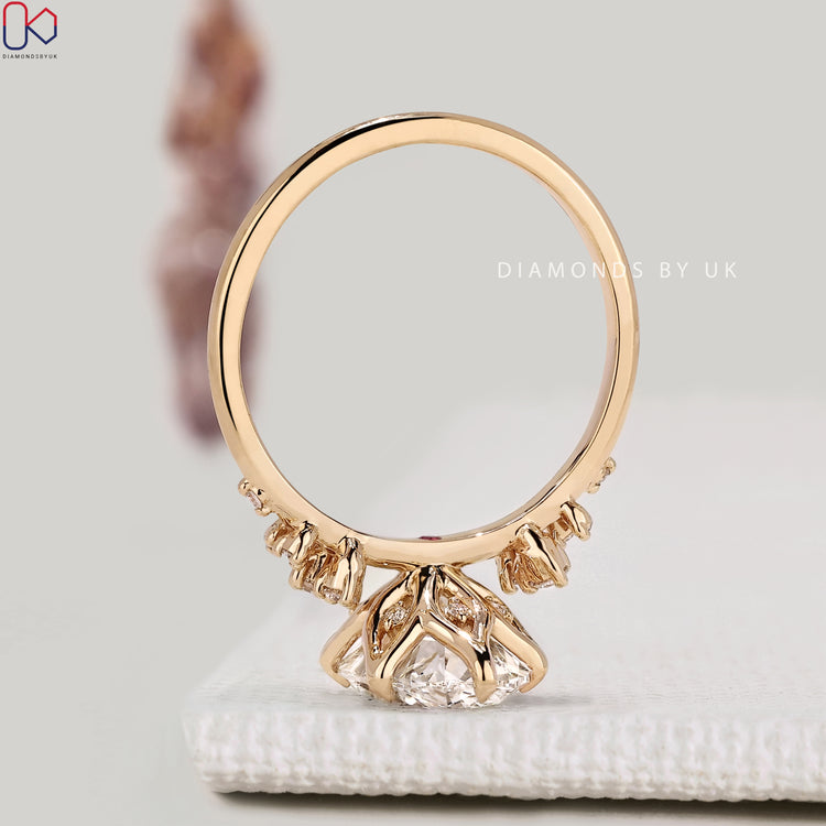 IGI certified oval diamond ring with round side stones.  
