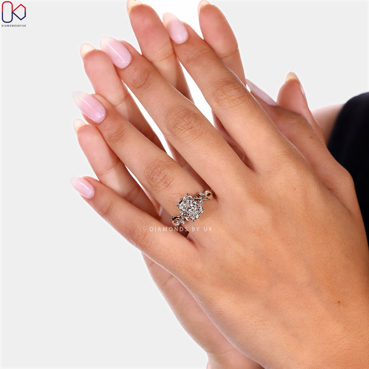 Radiant cut diamond ring with nature inspired setting.
