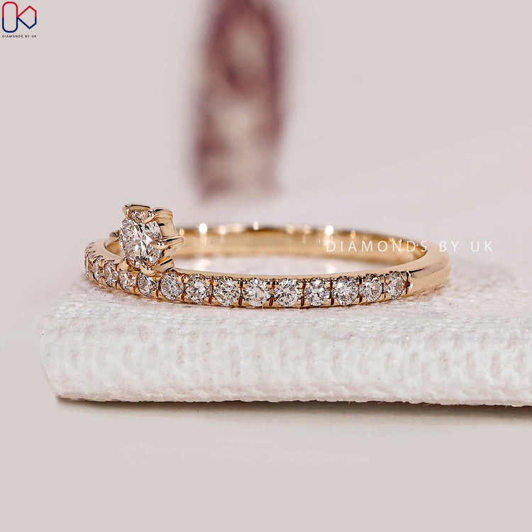 Handmade round diamond eternity band with six claws.
