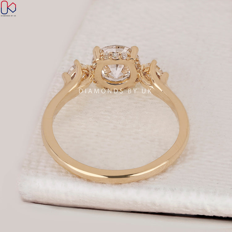 Handmade round cut ring with hidden halo setting.