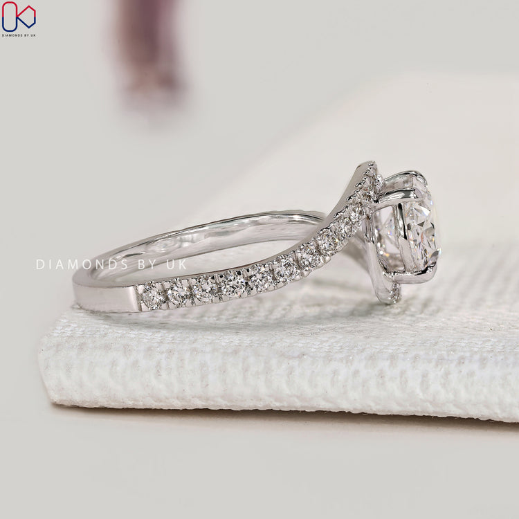 Handmade oval ring with four claw prong setting.
