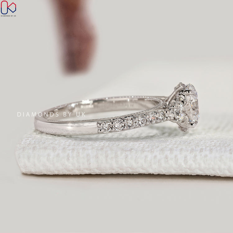 Handmade round diamond ring with cathedral setting.