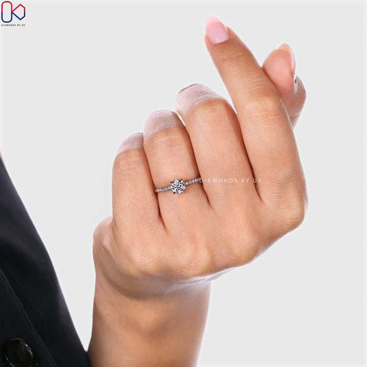 Round cut lab grown diamond ring with claw prong setting.
