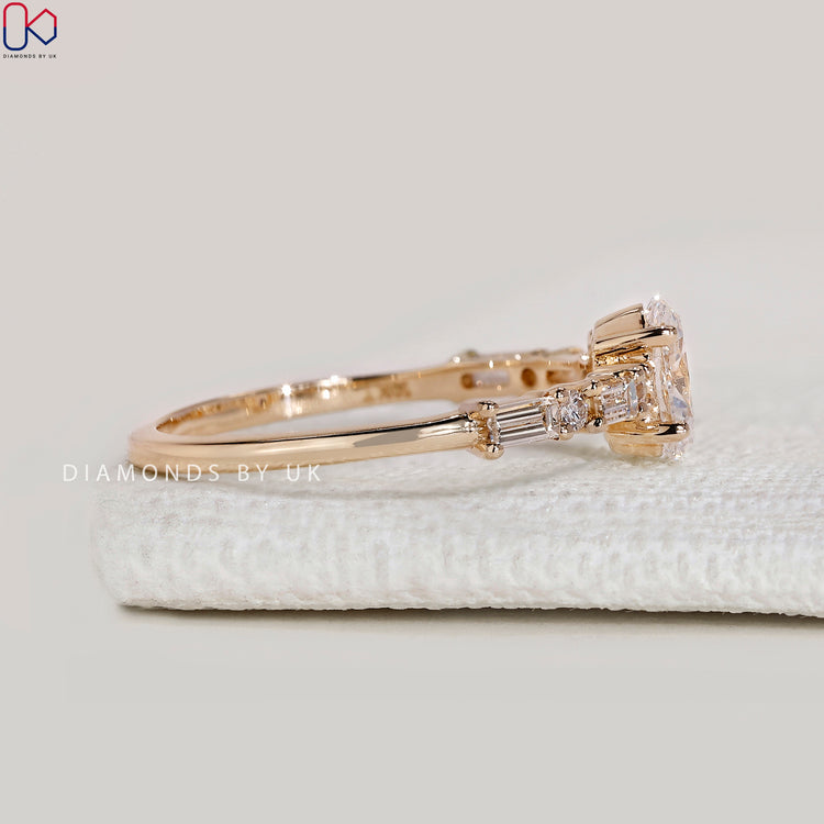 Handmade oval ring with baguette and round diamonds.