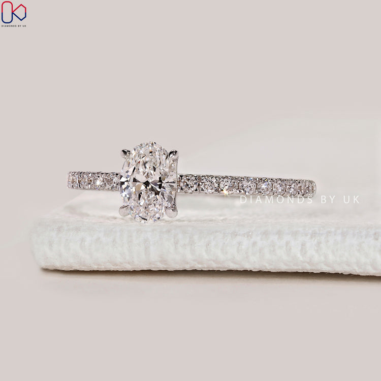 Oval cut lab grown diamond engagement ring.