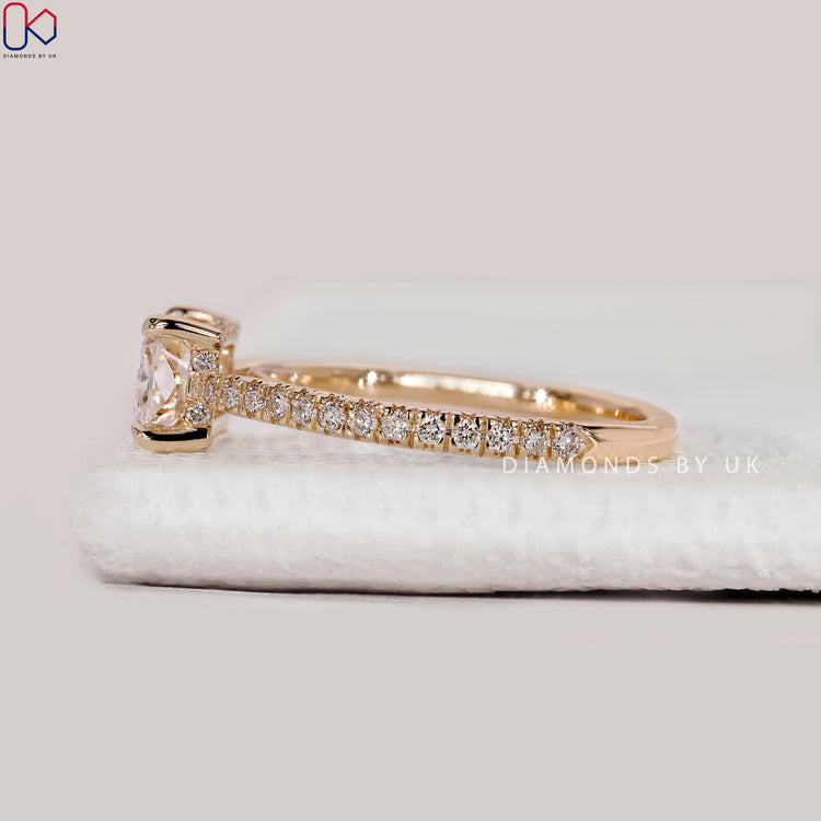 Handmade radiant cut ring with four claw prongs.