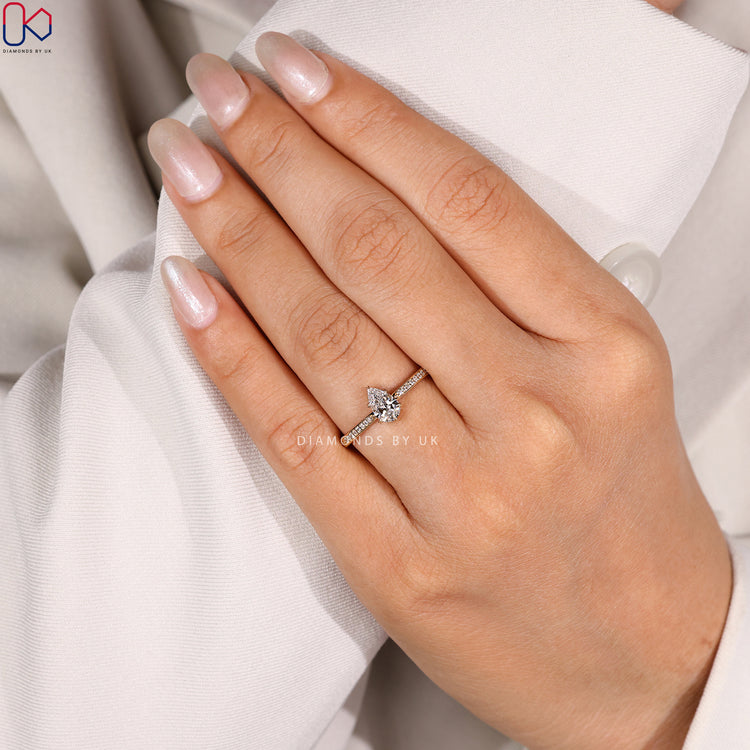 Lab grown pear cut ring with tapered pavé band.