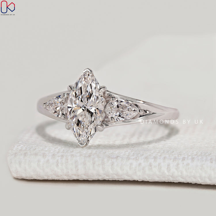 Marquise lab grown diamond ring with three stones.