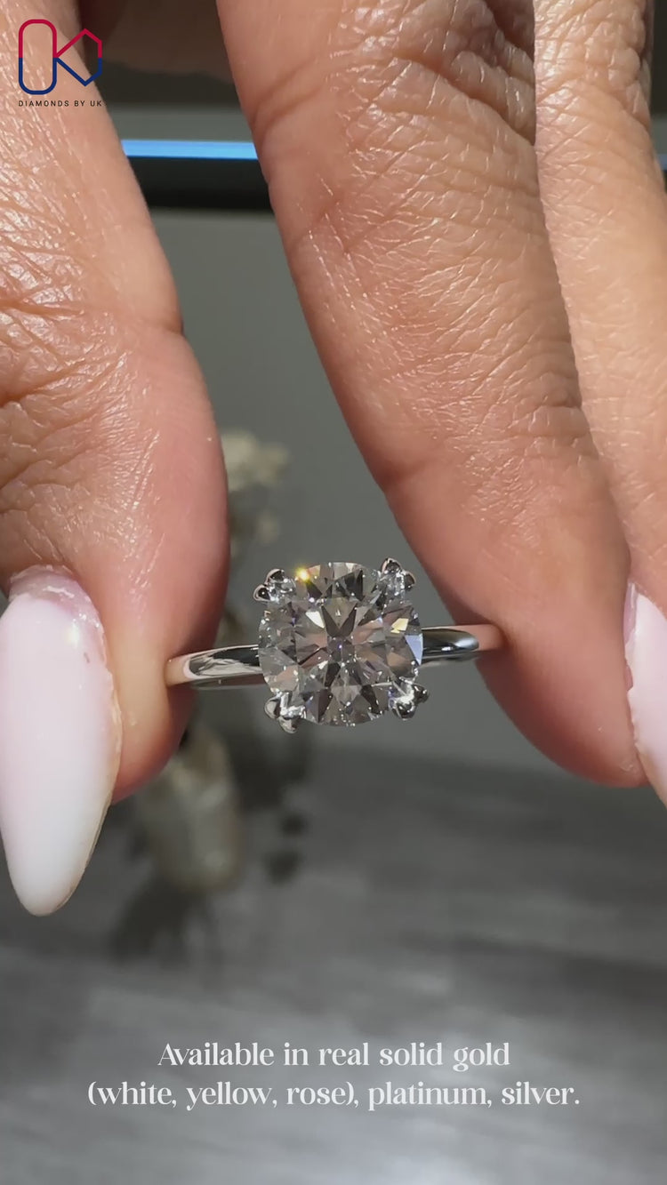 Round engagement ring in a double claw prong setting.
