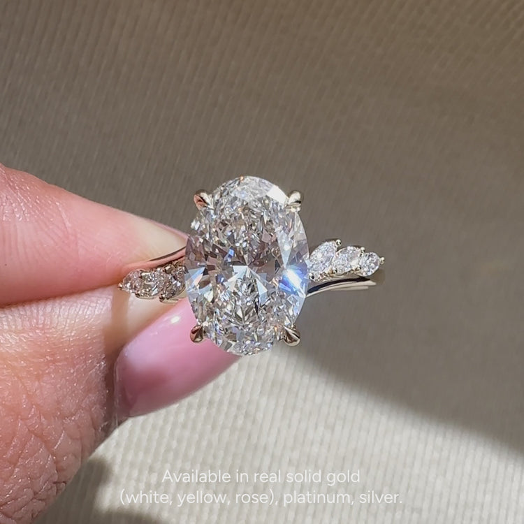 Lab grown oval engagement ring with cathedral setting.
