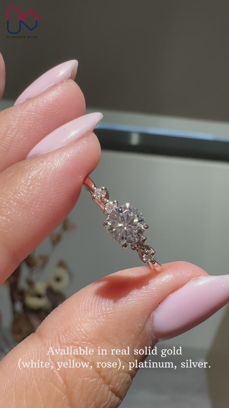 Round diamond five stone ring in prong setting.
