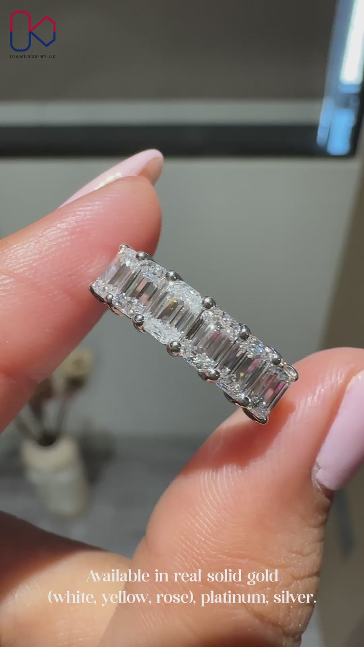 Half eternity wedding band with emerald cut diamonds.
