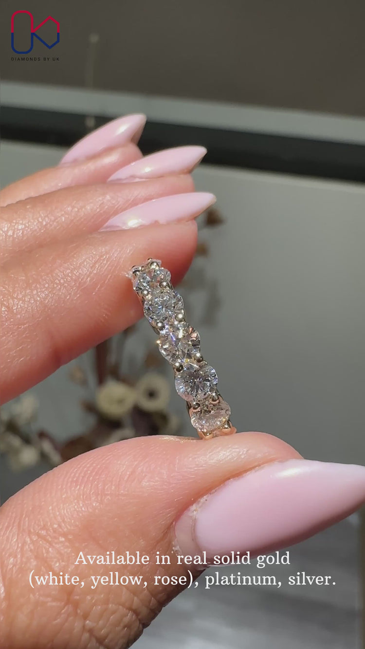 Elegant half eternity wedding band featuring brilliant craftsmanship.