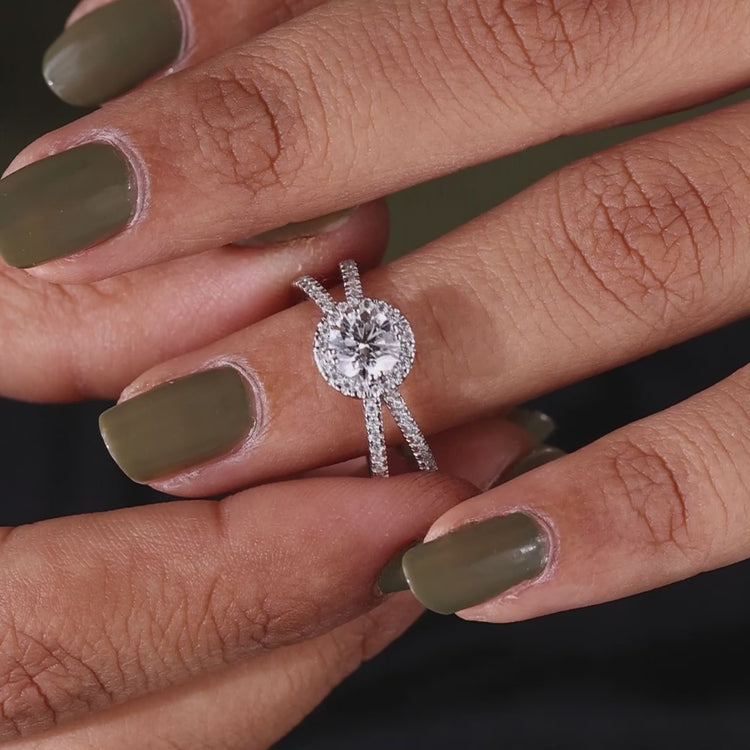 Pave setting ring with a brilliant round diamond ring set in a white gold ring band.