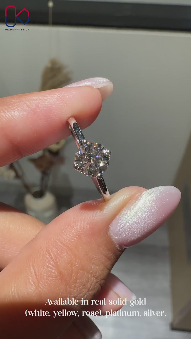 Elegant compass prong diamond ring by Diamondsbyuk.
