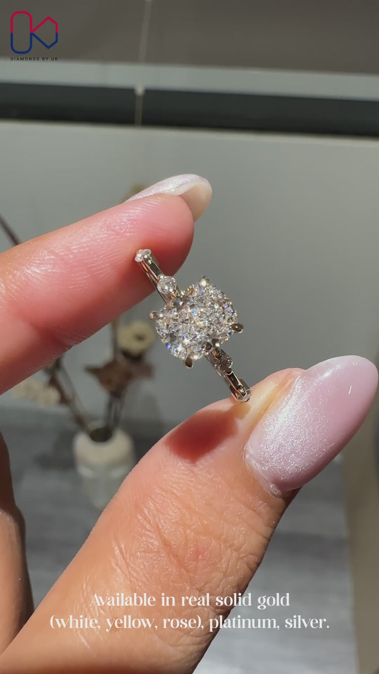 Distance pave engagement ring with elongated cushion diamond.
