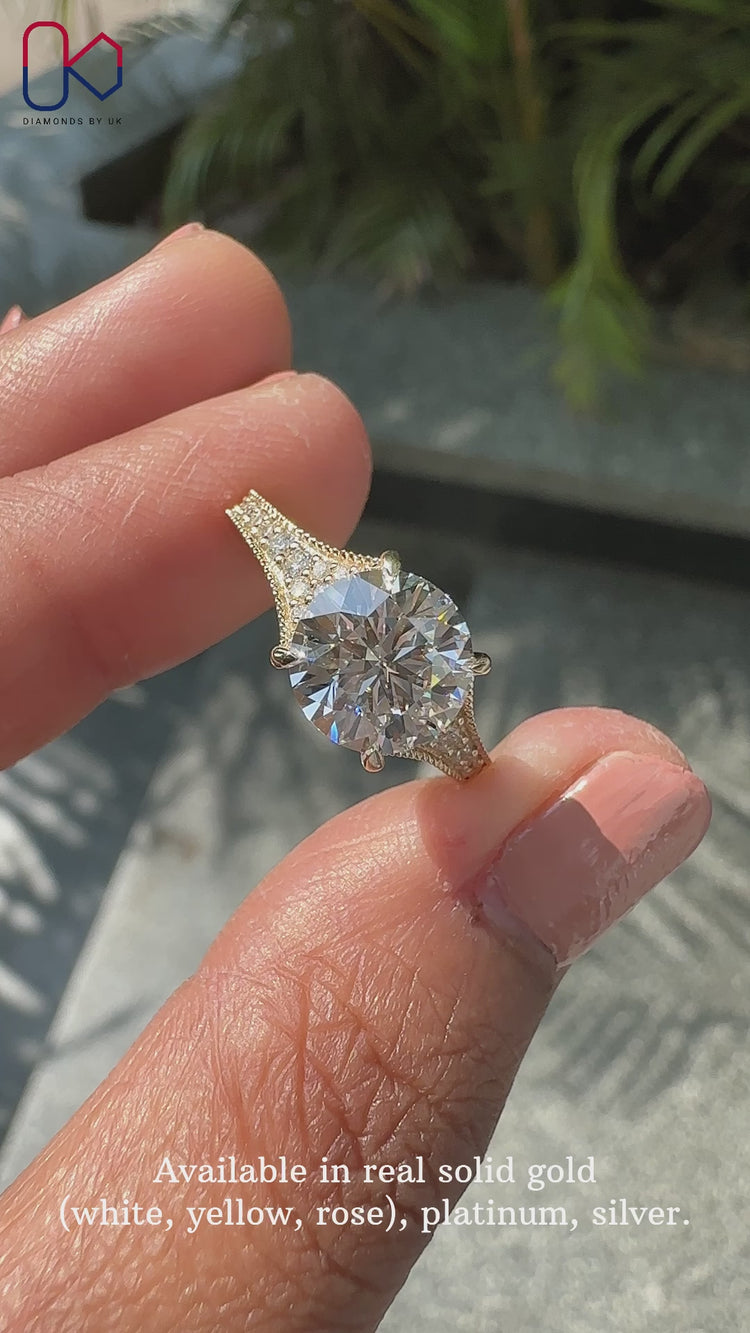 Tapered band ring featuring a beautiful round brilliant cut diamond ring design.