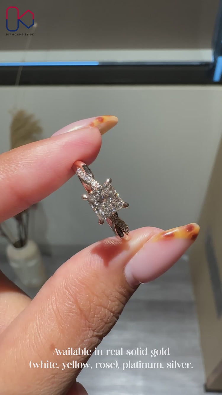 Princess diamond ring in rose gold with claw prongs.
