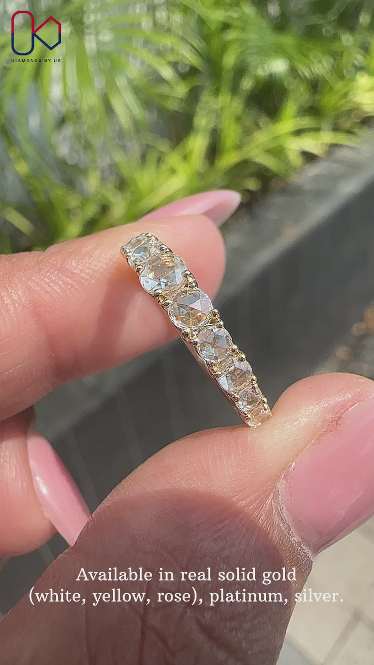 Elegant rose cut diamond wedding band featuring delicate diamonds.
