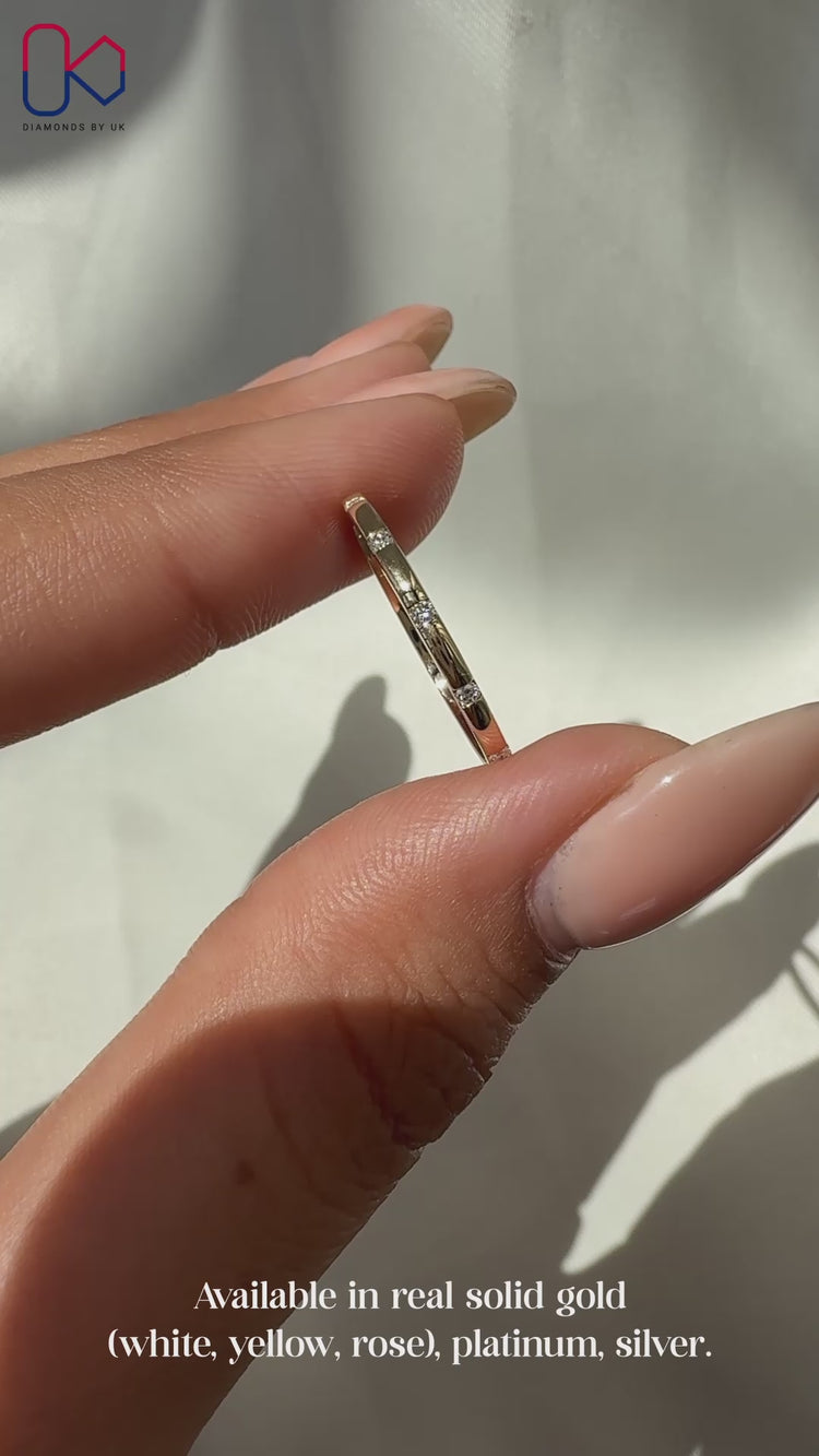 Diamond distance band crafted in yellow gold.
